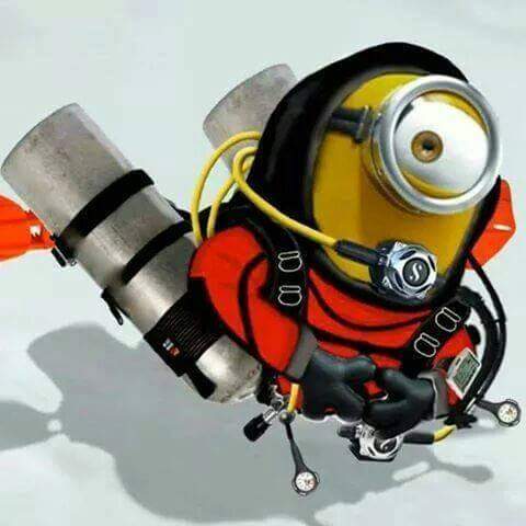 Cartoon minion character dressed in a diving helmet with twin sidemount cylinders